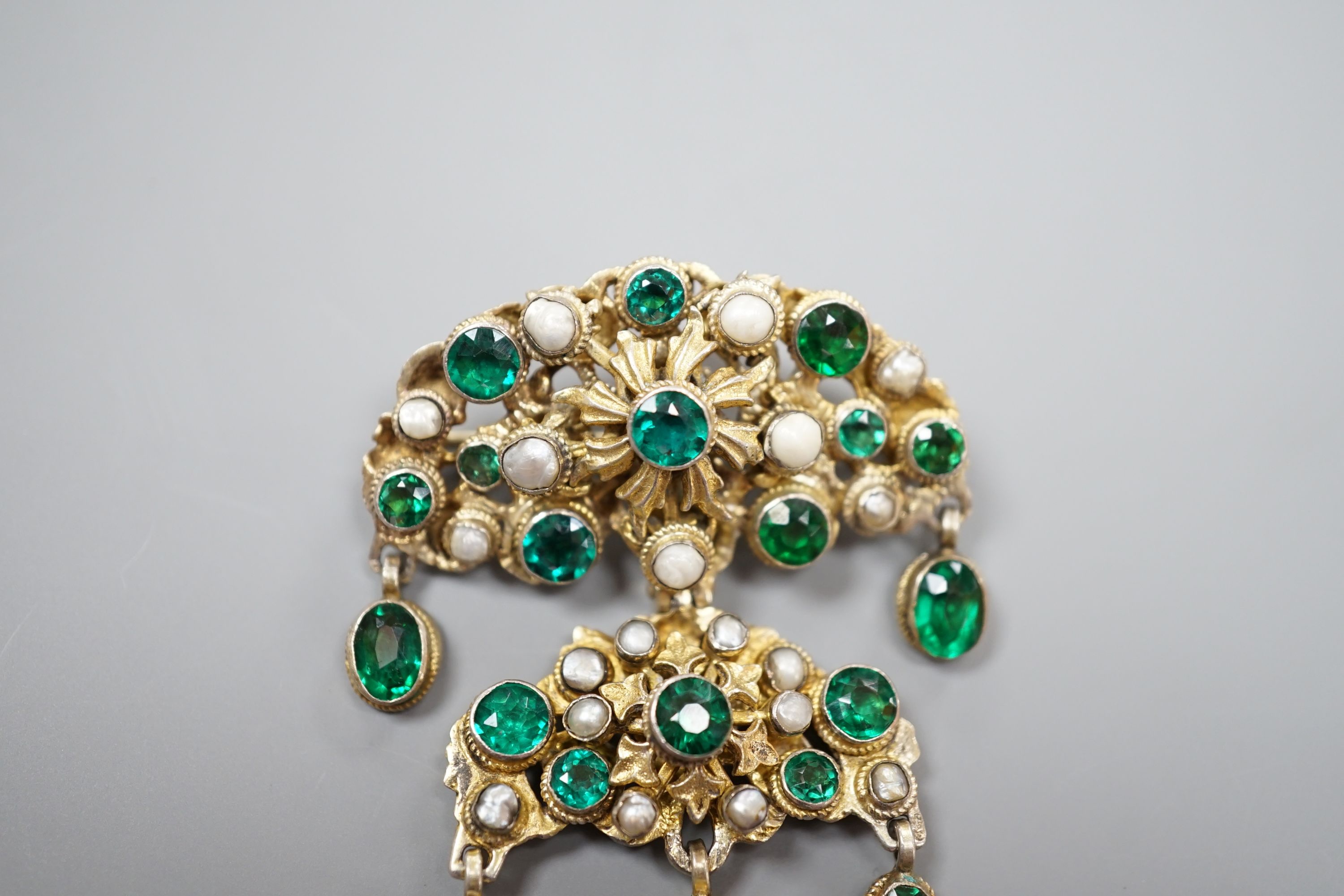 An Austro Hungarian gilt white metal, baroque pearl and green paste set drop pendant brooch, 59mm.